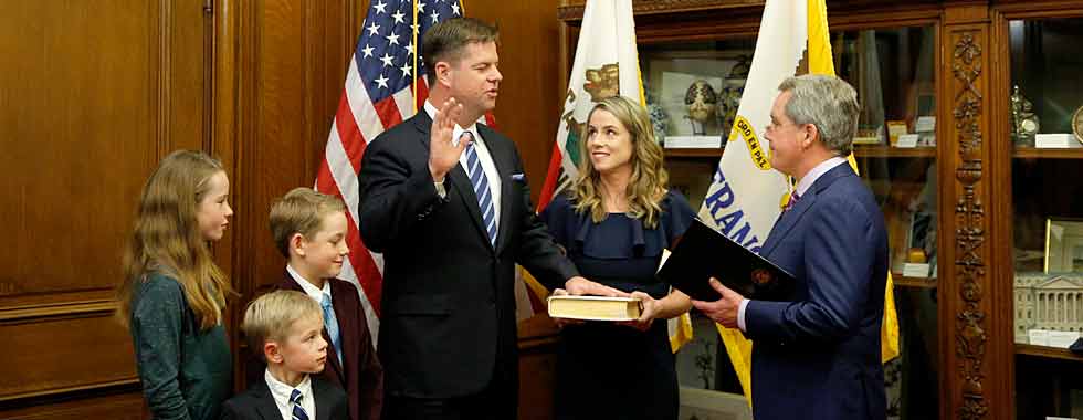 Mayor Farrell being sworn into office with family at his side