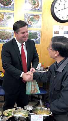 Mayor Farrell greeting a citizen